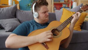 Male playing Guitar